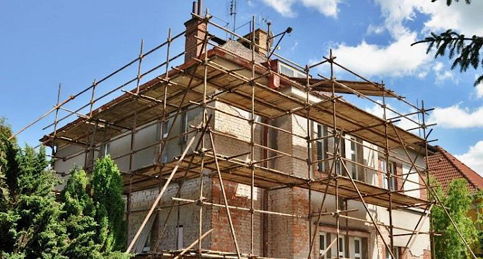 house with full scaffolding around it