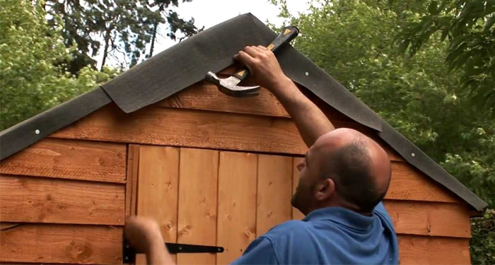 Blue Shirt Man Hammer Felt Roof