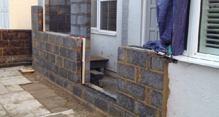 Brick porch with green door