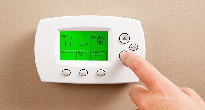 White thermostat with green screen