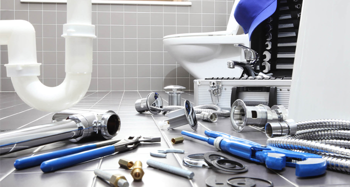 Plumbing Supplies on Bathroom Floor