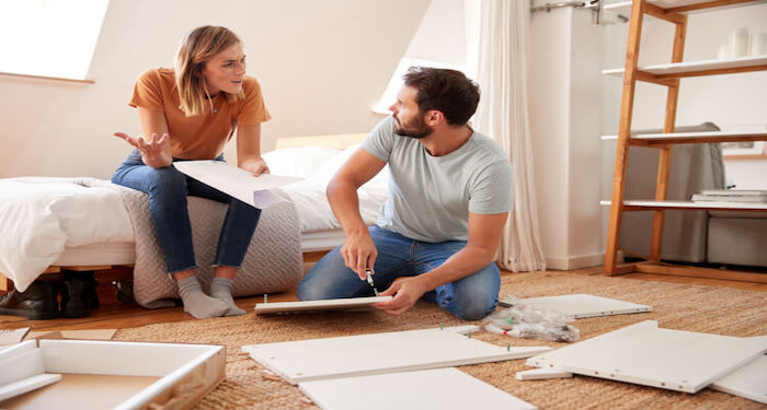 couple assembling flatpack furniture