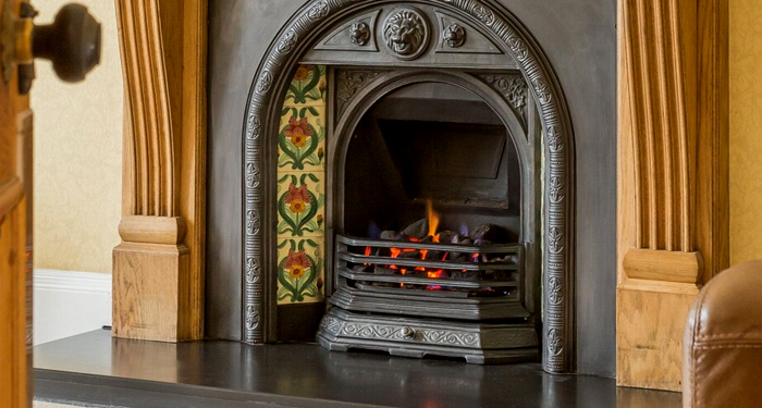 wood and cast iron fireplace