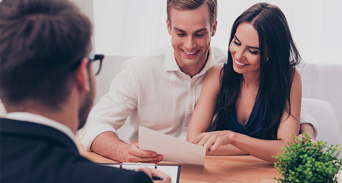 Couple at desk with lender