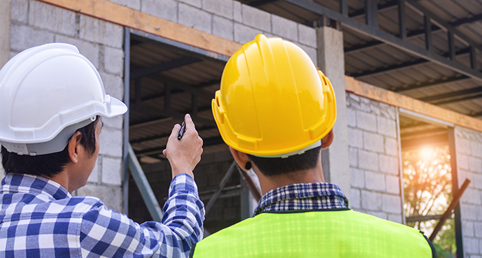 yellow and white hard hats workmen