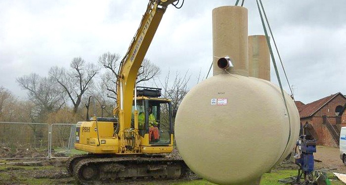 Septic tank installation by crane