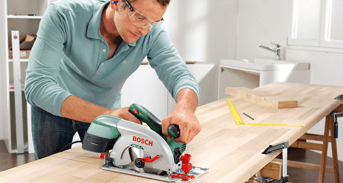 Man using a mitre saw