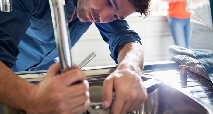 Plumber Fixing Tap