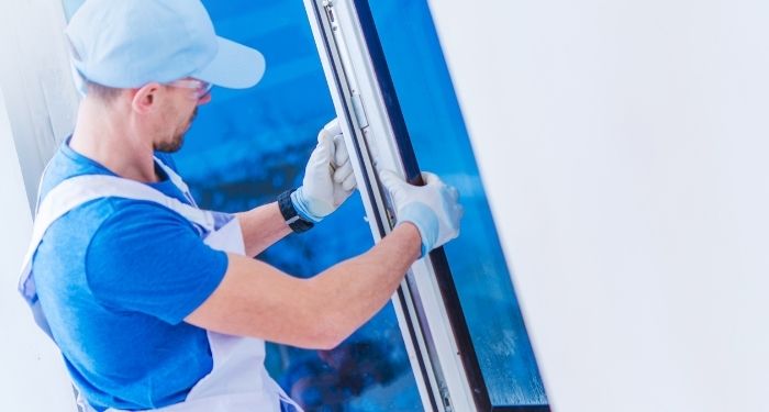 a man installing a window