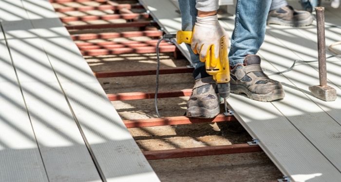 Man installing composite decking