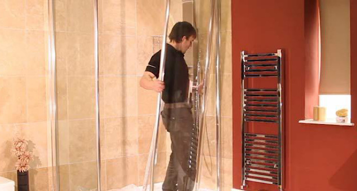 man installing a shower
