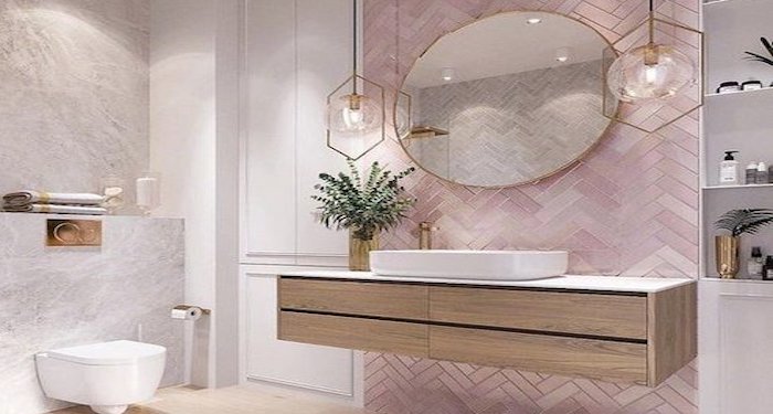 Ensuite bathroom furniture with pink tiled wall