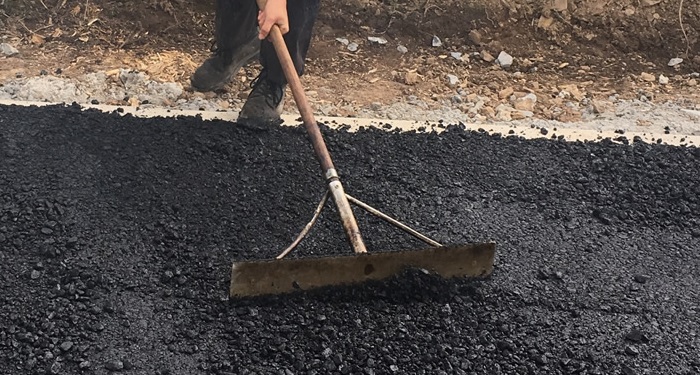 Rake over a tarmac driveway