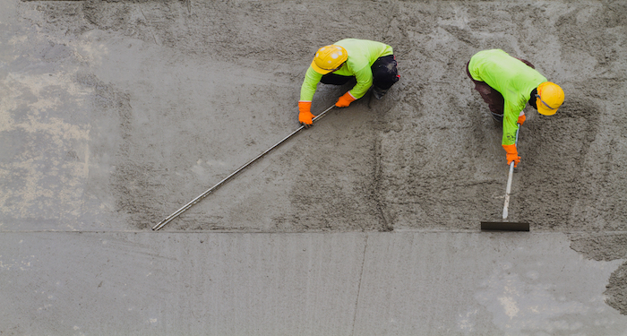 tradesmen pouring concrete