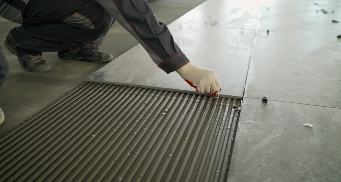 Large tiles being laid