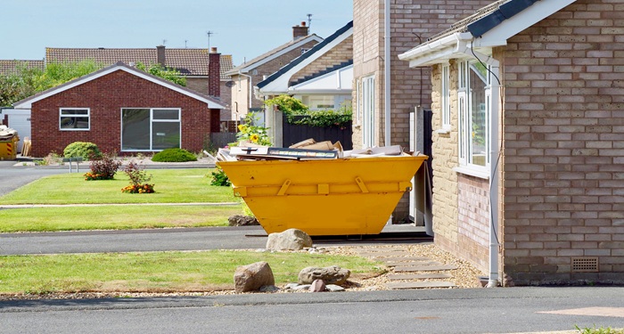 Waste skip outside house