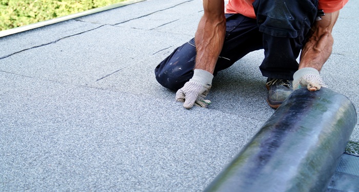 Man laying flat roof