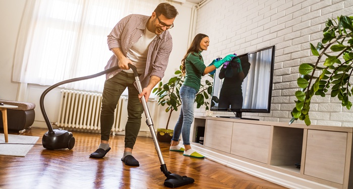 Couple vacuuming