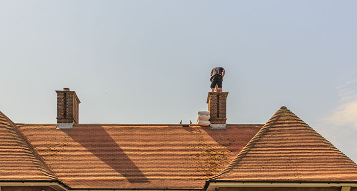 man installing Chimney Liner