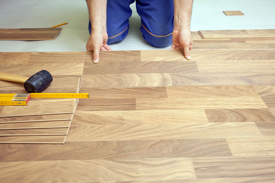 Man Installing Laminate Flooring