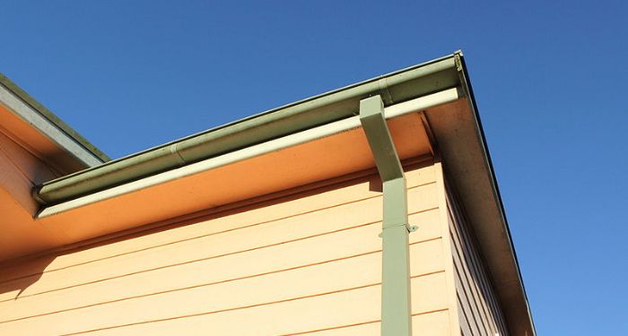 green guttering on wooden house