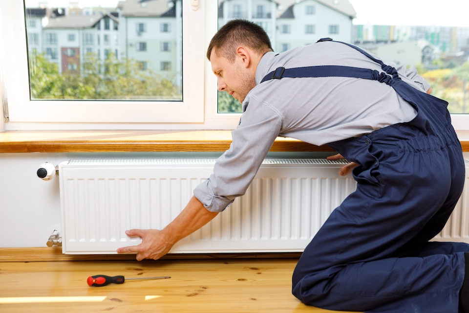 workman removing a radiator