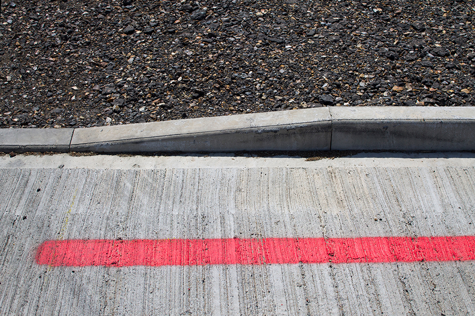 dropped kerb and red line