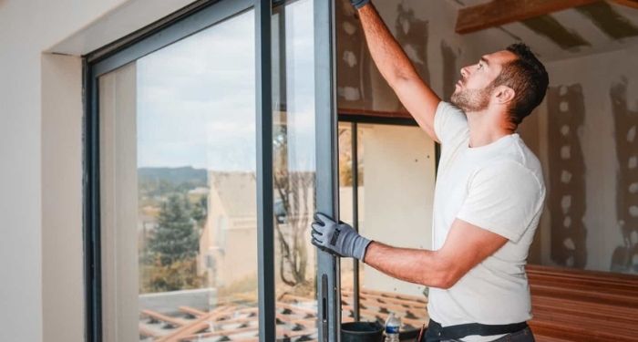 Man removing triple glazing