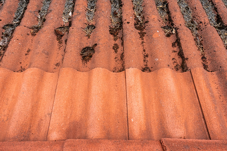 dirty roof being cleaned