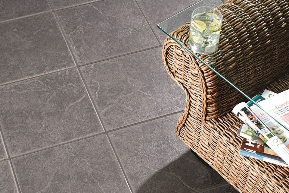 grey tiled floor with chair
