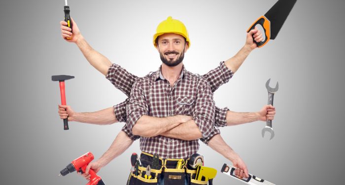 man holding multiple tools